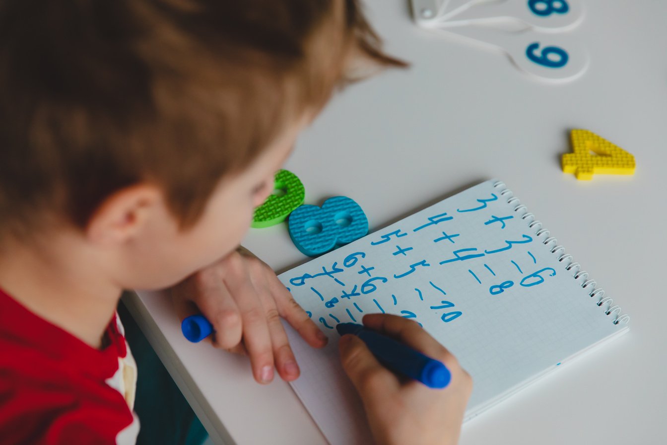 child calculating numbers, kid doing homework, math for kids